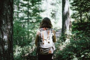 A woman hiking in the woods