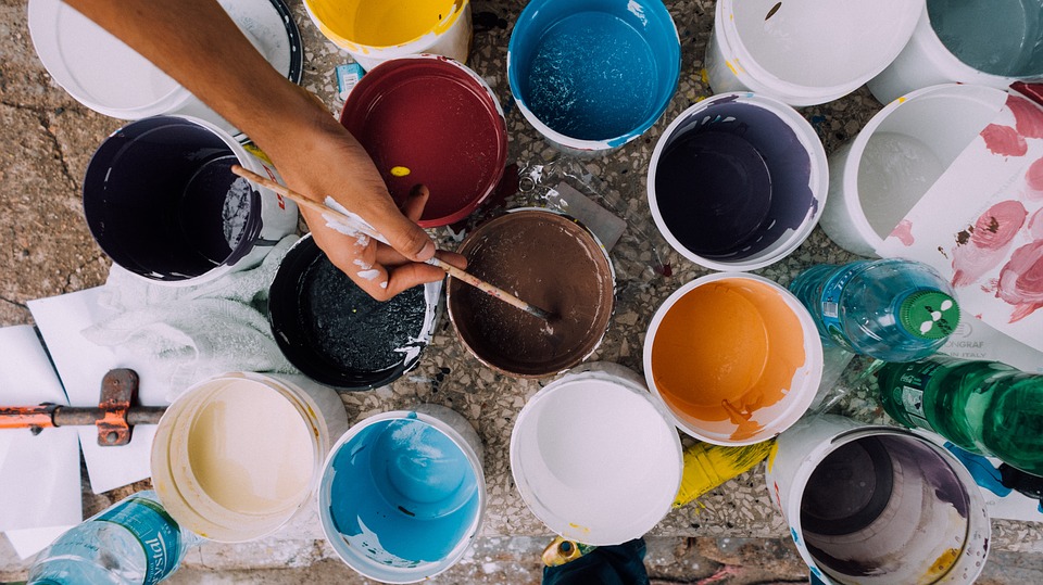 A collection of open paint cans.