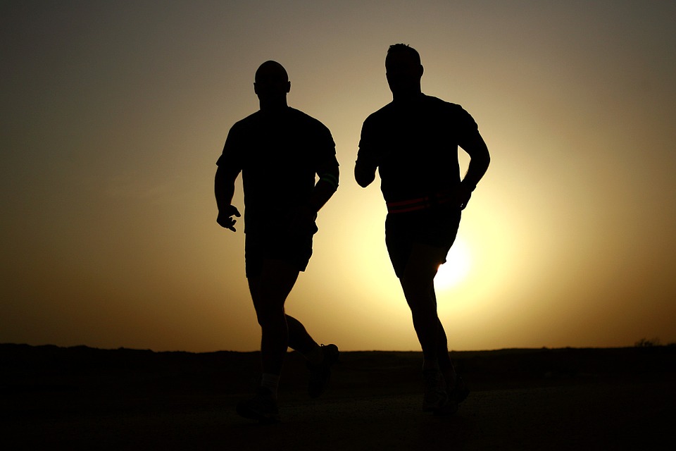 Two men running.